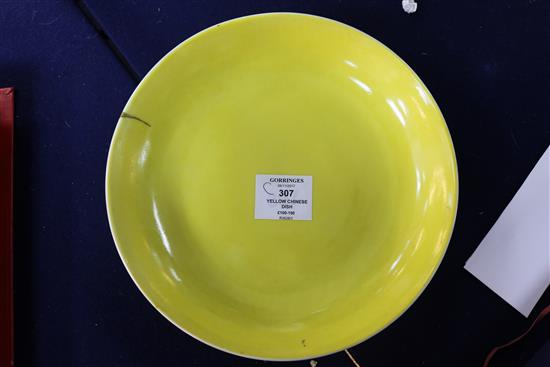 A Chinese yellow glazed dish, Jiaqing mark, gilt repair